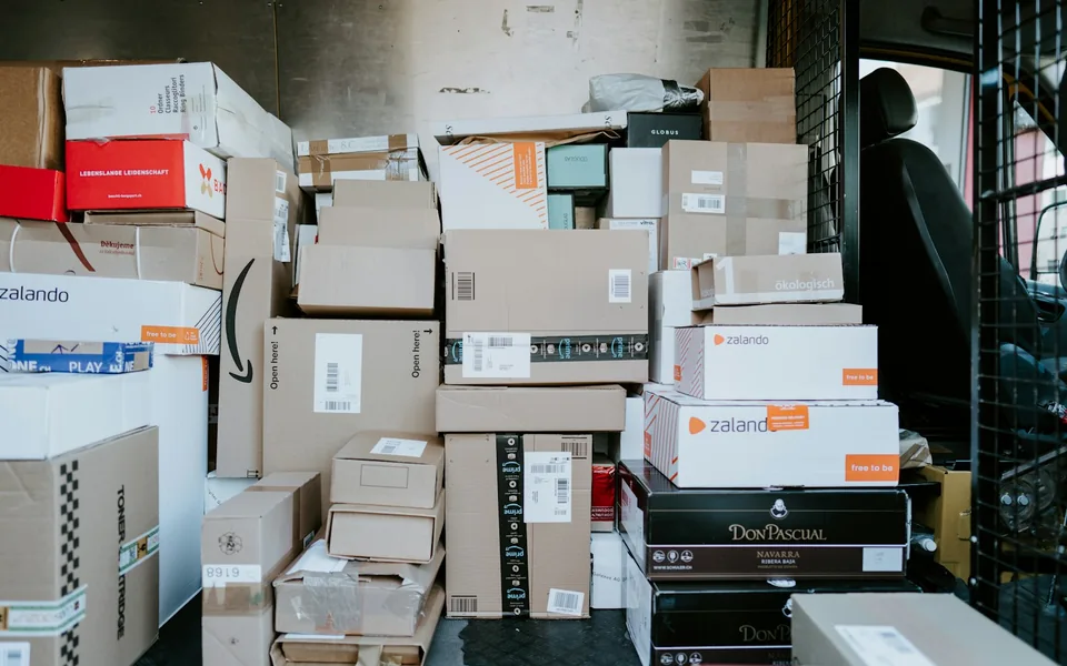 Parcel boxes packed inside a delivery van.