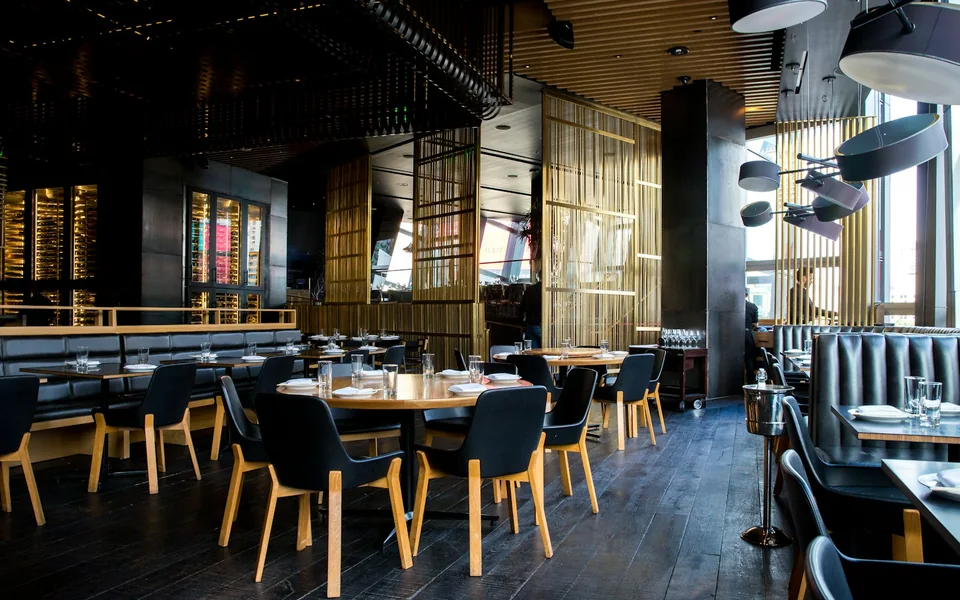 Dining tables and seating inside a restaurant.