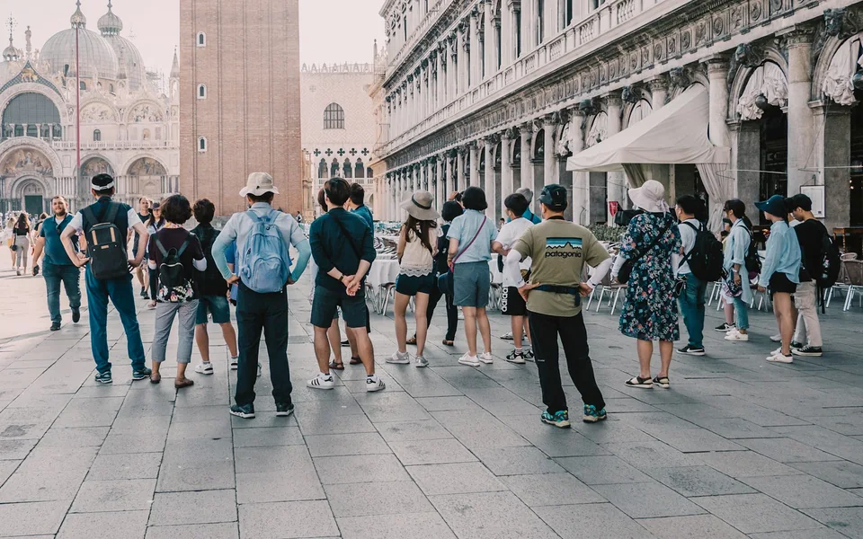 Tour group gathered on a city street.
